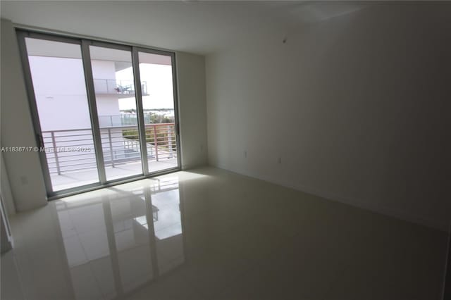 7875 NW 107th Ct Unit 519 4, Doral, FL 33178 - unfurnished room with floor to ceiling windows