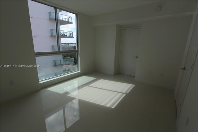 7875 NW 107th Ct Unit 519 4, Doral, FL 33178 - spare room featuring a smoke detector and tile patterned floors