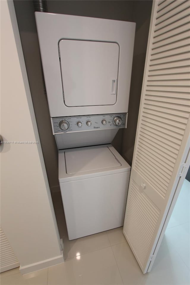 7875 NW 107th Ct Unit 519 4, Doral, FL 33178 - laundry area with stacked washer / drying machine and light tile patterned flooring