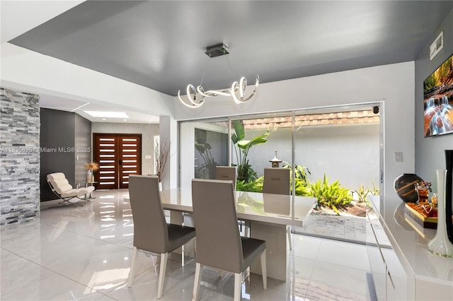 5712 White Hickory Cir, Tamarac, FL 33319 - tiled dining space with a chandelier