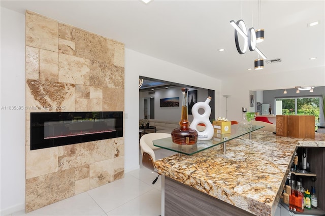 5712 White Hickory Cir, Tamarac, FL 33319 - kitchen with a tile fireplace, open floor plan, tile patterned flooring, and recessed lighting
