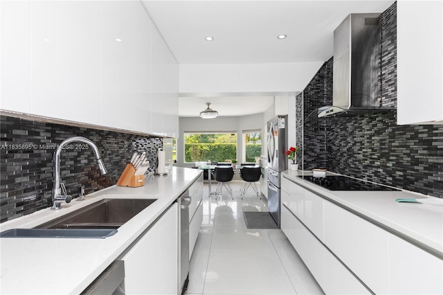 5712 White Hickory Cir, Tamarac, FL 33319 - kitchen featuring wall chimney exhaust hood, modern cabinets, black electric cooktop, white cabinetry, and recessed lighting