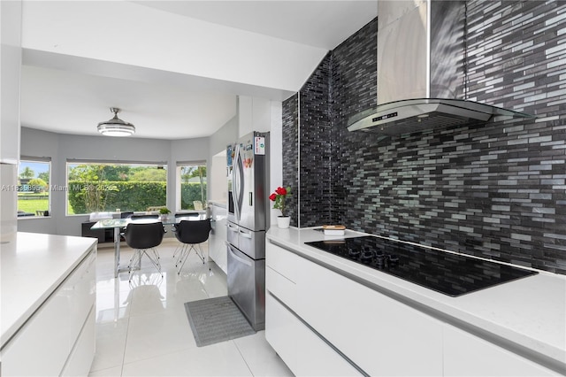 5712 White Hickory Cir, Tamarac, FL 33319 - kitchen with exhaust hood, black electric stovetop, stainless steel fridge with ice dispenser, and backsplash