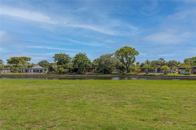 5712 White Hickory Cir, Tamarac, FL 33319 - view of community featuring a water view and a yard