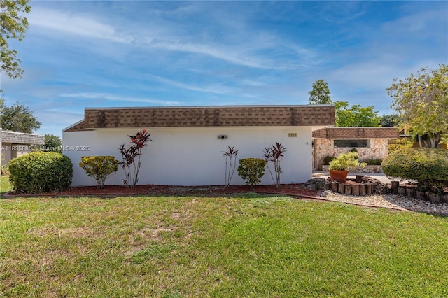 5712 White Hickory Cir, Tamarac, FL 33319 - view of property exterior featuring a lawn, stucco siding, and mansard roof