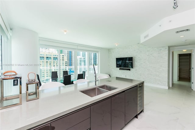 1080 Brickell Ave Unit 1708, Miami, FL 33131 - kitchen with gray cabinets, light marble finish flooring, modern cabinets, light countertops, and wine cooler