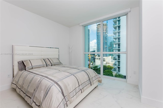 1080 Brickell Ave Unit 1708, Miami, FL 33131 - bedroom with marble look tile flooring, a city view, and multiple windows