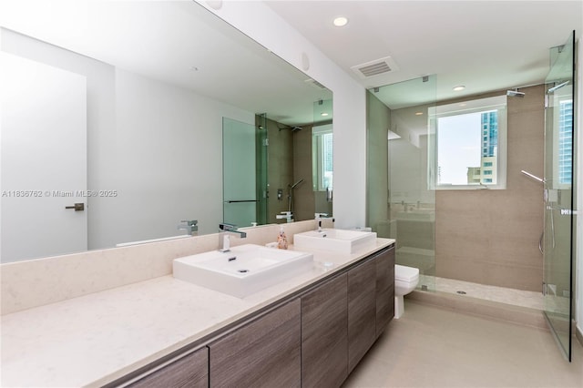 1080 Brickell Ave Unit 1708, Miami, FL 33131 - full bath with double vanity, tiled shower, plenty of natural light, and recessed lighting