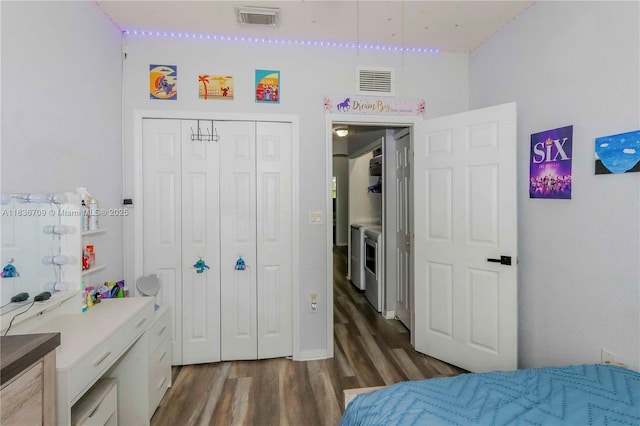 12548 SW 126th Ave, Miami, FL 33186 - bedroom with dark wood-style floors, a closet, and washer / dryer