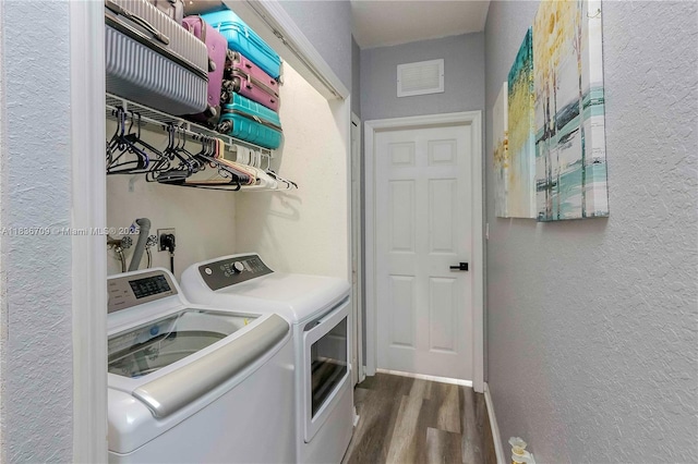 12548 SW 126th Ave, Miami, FL 33186 - laundry room featuring separate washer and dryer, a textured wall, and dark wood-type flooring