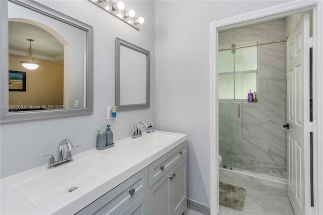 12548 SW 126th Ave, Miami, FL 33186 - full bathroom with double vanity, a shower stall, and crown molding