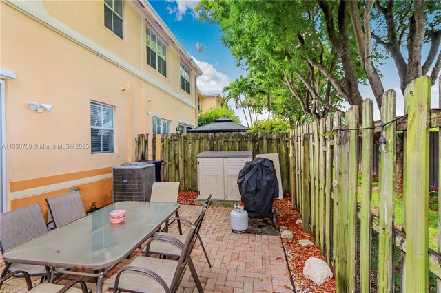 12548 SW 126th Ave, Miami, FL 33186 - view of patio / terrace with outdoor dining space and a grill
