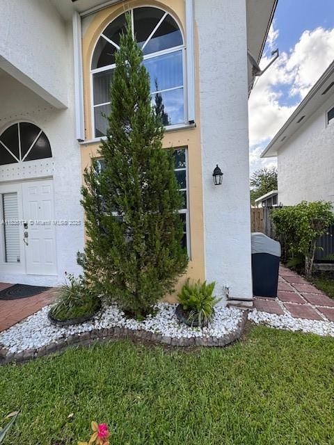 628 Turtle Run, Weston, FL 33326 - property entrance featuring stucco siding