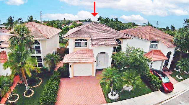 628 Turtle Run, Weston, FL 33326 - mediterranean / spanish house featuring a tile roof, stucco siding, and driveway