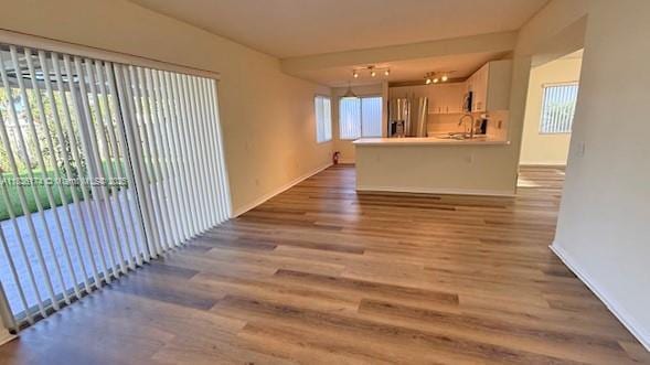 628 Turtle Run, Weston, FL 33326 - unfurnished living room with wood finished floors