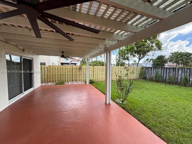 628 Turtle Run, Weston, FL 33326 - fenced backyard featuring ceiling fan, a pergola, and a patio area