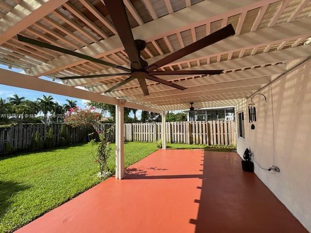 628 Turtle Run, Weston, FL 33326 - fenced backyard featuring ceiling fan and a patio area