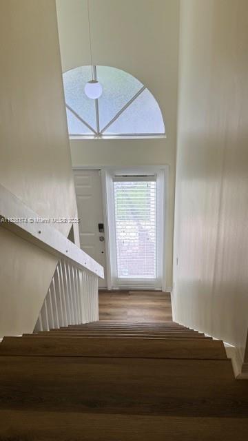 628 Turtle Run, Weston, FL 33326 - stairs featuring wood finished floors