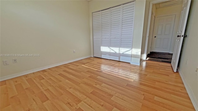 628 Turtle Run, Weston, FL 33326 - unfurnished bedroom featuring light wood-style flooring and a closet
