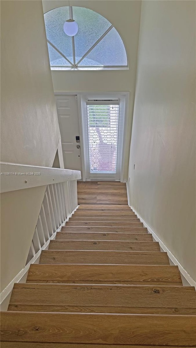 628 Turtle Run, Weston, FL 33326 - stairway featuring wood finished floors