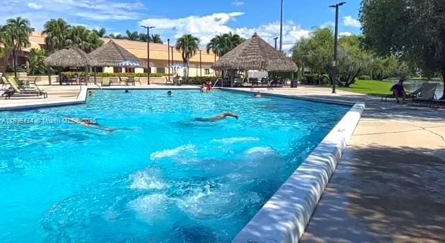 628 Turtle Run, Weston, FL 33326 - community pool with a gazebo and a patio