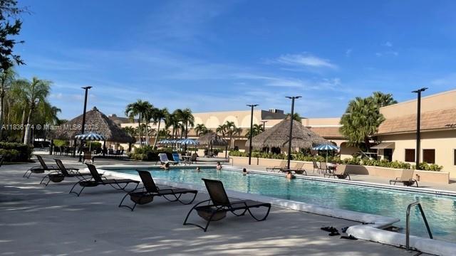 628 Turtle Run, Weston, FL 33326 - community pool with a patio