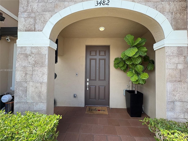 3482 114th Ter, Hialeah, FL 33018 - view of exterior entry with stone siding and stucco siding