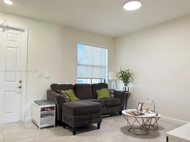 3482 114th Ter, Hialeah, FL 33018 - living area with light tile patterned floors and baseboards