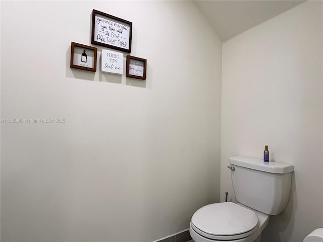 3482 114th Ter, Hialeah, FL 33018 - bathroom featuring toilet and lofted ceiling