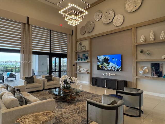 3482 114th Ter, Hialeah, FL 33018 - living room with light tile patterned flooring, built in shelves, a chandelier, and a high ceiling