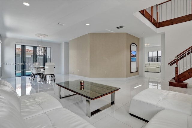 1007 NW 99th Ct, Miami, FL 33172 - living room featuring light tile patterned flooring, healthy amount of natural light, recessed lighting, a chandelier, and stairs