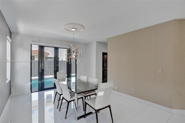 1007 NW 99th Ct, Miami, FL 33172 - dining room featuring a chandelier and baseboards