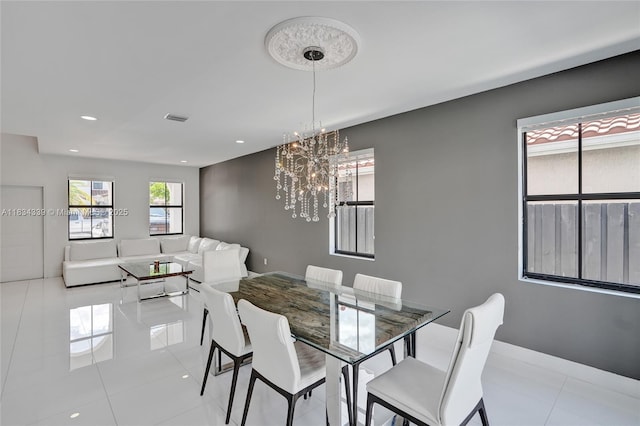 1007 NW 99th Ct, Miami, FL 33172 - tiled dining area with a chandelier and recessed lighting