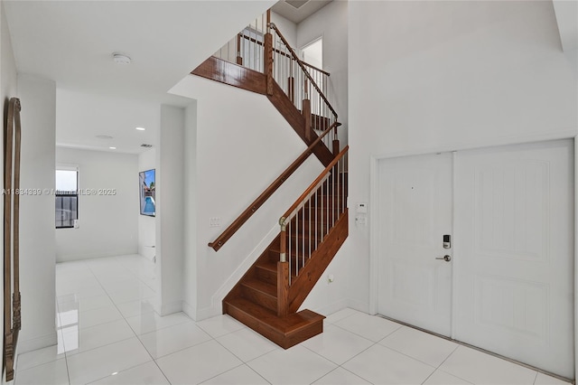 1007 NW 99th Ct, Miami, FL 33172 - foyer entrance with stairway and tile patterned floors