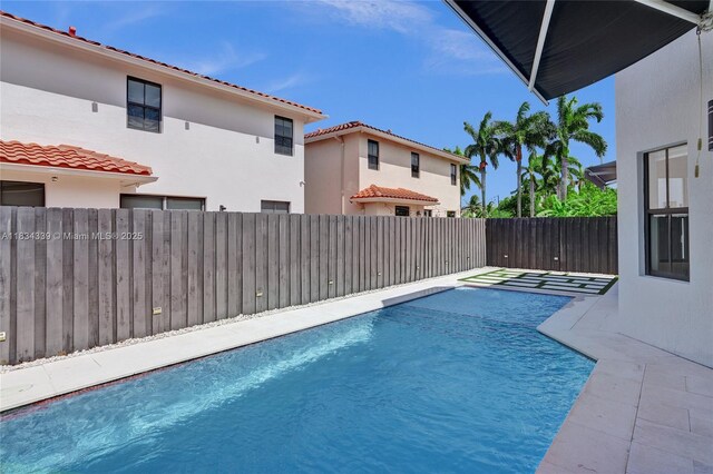 1007 NW 99th Ct, Miami, FL 33172 - view of swimming pool with a fenced backyard