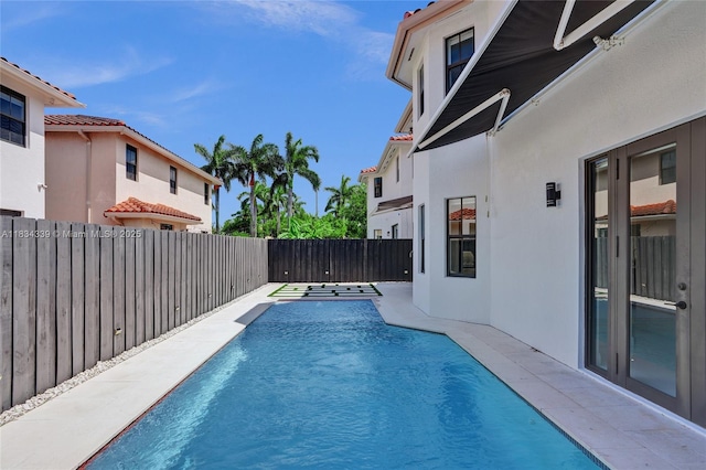 1007 NW 99th Ct, Miami, FL 33172 - view of swimming pool featuring a fenced backyard