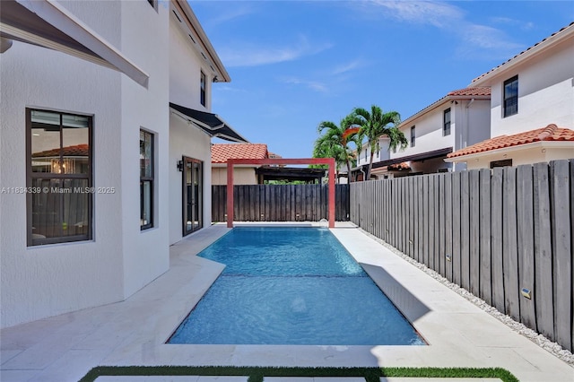 1007 NW 99th Ct, Miami, FL 33172 - view of swimming pool featuring a fenced backyard and a patio area