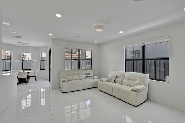 1007 NW 99th Ct, Miami, FL 33172 - living room featuring a chandelier, plenty of natural light, light tile patterned floors, and recessed lighting