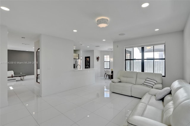 1007 NW 99th Ct, Miami, FL 33172 - living room featuring light tile patterned flooring and recessed lighting