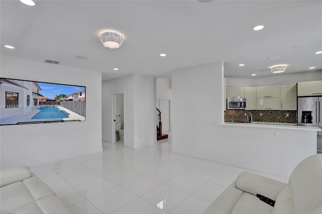 1007 NW 99th Ct, Miami, FL 33172 - living area featuring recessed lighting, light tile patterned flooring, and stairway