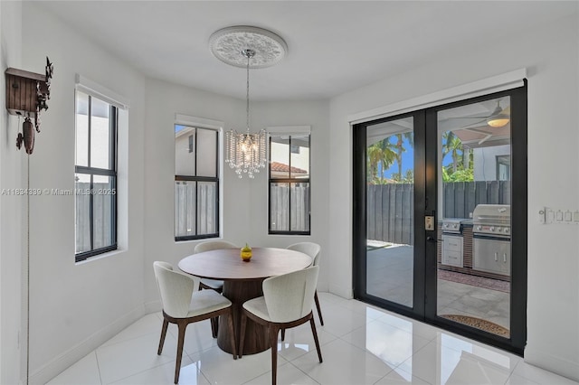 1007 NW 99th Ct, Miami, FL 33172 - dining room with french doors, a chandelier, and light tile patterned floors