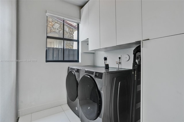 1007 NW 99th Ct, Miami, FL 33172 - laundry room with cabinet space, washer and dryer, and tile patterned flooring
