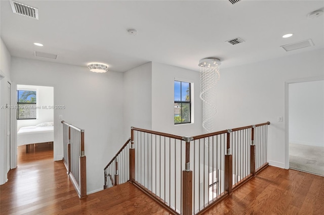 1007 NW 99th Ct, Miami, FL 33172 - hall with an upstairs landing, wood finished floors, and recessed lighting