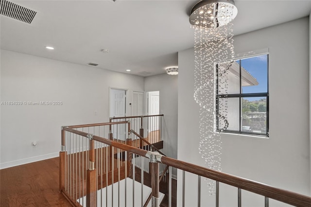1007 NW 99th Ct, Miami, FL 33172 - corridor featuring an upstairs landing, wood finished floors, recessed lighting, and a chandelier