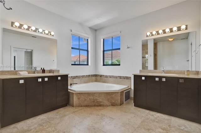 1007 NW 99th Ct, Miami, FL 33172 - bathroom with a garden tub and two vanities