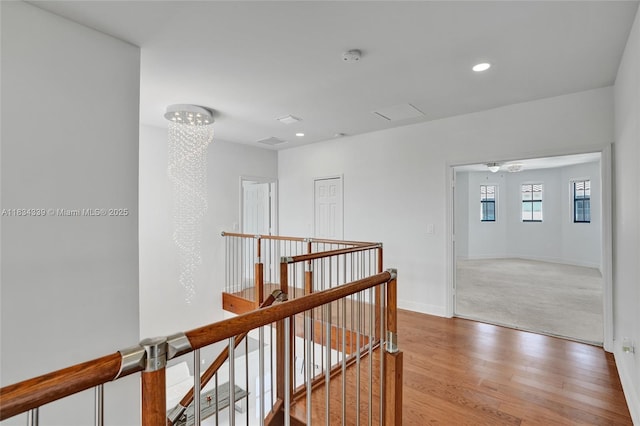 1007 NW 99th Ct, Miami, FL 33172 - corridor with an upstairs landing, light wood-style floors, and recessed lighting