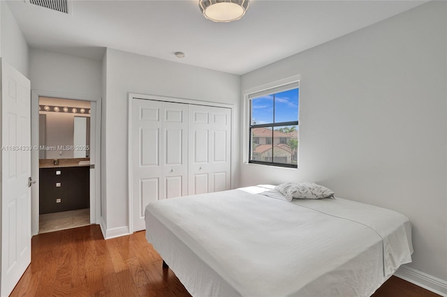 1007 NW 99th Ct, Miami, FL 33172 - bedroom featuring wood finished floors and a closet