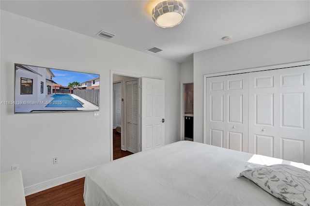 1007 NW 99th Ct, Miami, FL 33172 - bedroom featuring dark wood-style flooring and a closet