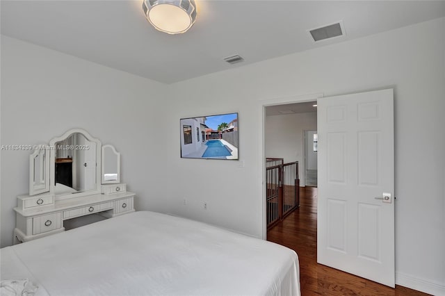 1007 NW 99th Ct, Miami, FL 33172 - bedroom with dark wood-style flooring