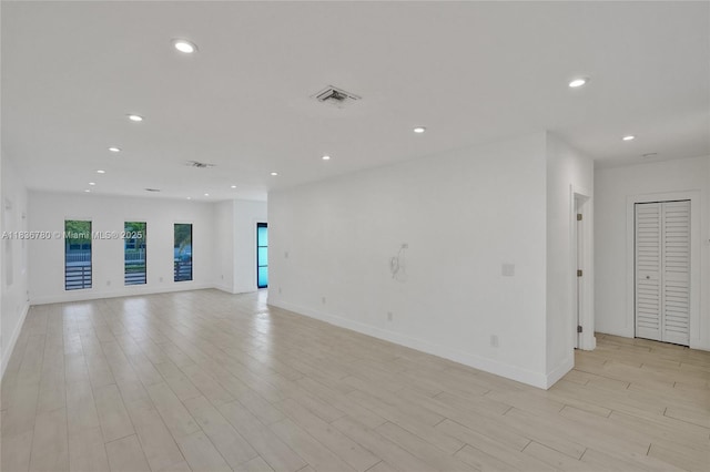 120 NW 41st St, Miami, FL 33127 - unfurnished room with recessed lighting and light wood-style floors